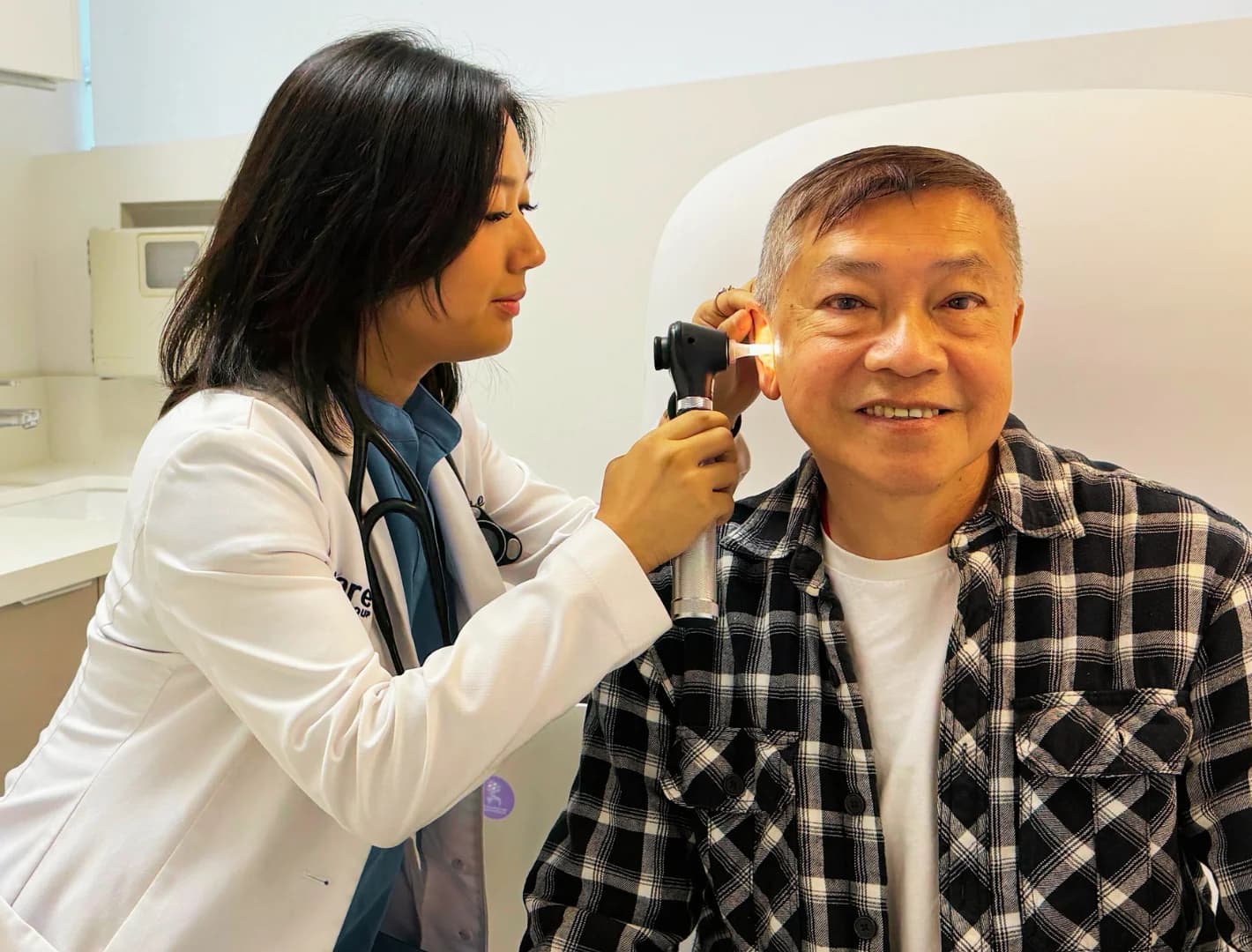 Doctor performing annual checkup
